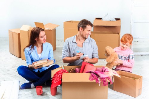 Office removals planning in Leamouth with moving boxes and workspace setup