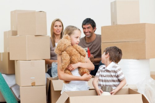 Removal team handling fragile household items during a Leamouth move